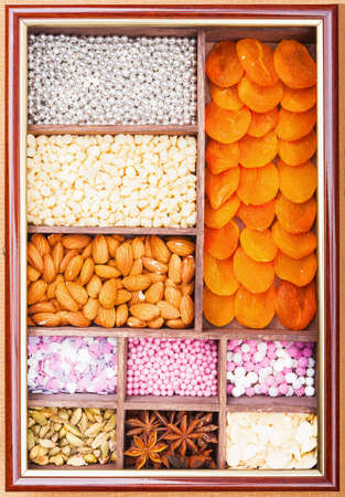 Wooden box with spices and decorations for pastryの写真素材