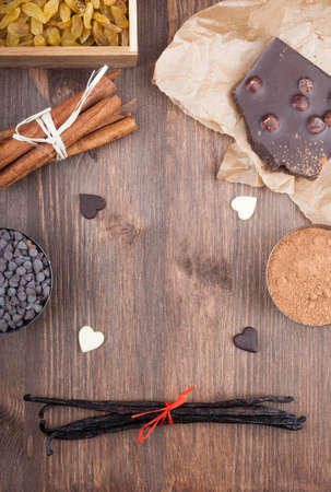 Ingredients for baking chocolate on a dark wooden backgroundの写真素材