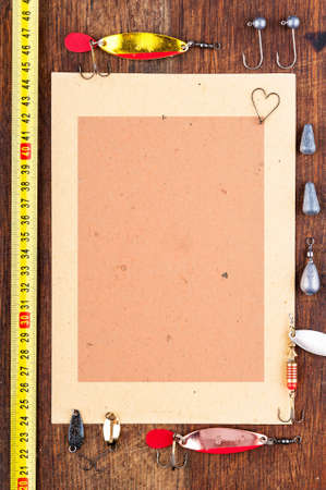 Sheet to record the results of fishing surrounded by fishing gearの写真素材