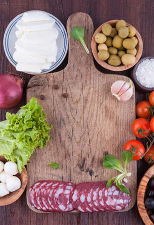 Typical Italian products on wooden boardの写真素材
