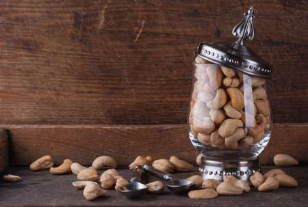 Cashew nuts in a glass vessel, closeupの写真素材