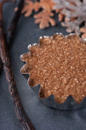 Smoked vanilla sugar cane on a slate blackboardの写真素材