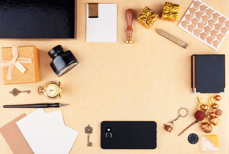 Workplace with empty space surrounded by office supplies. Christmas card and new year holidays template. Top viewの写真素材