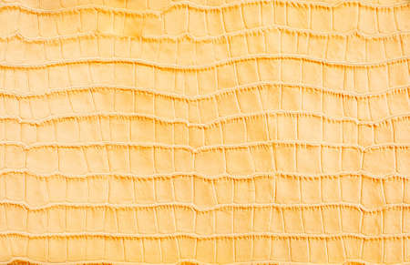 Yellow stylized imitation crocodile skin backgroundの写真素材