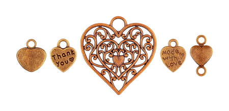 Set of metal old pendants in the shape of a heart isolatedの写真素材