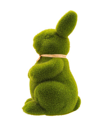 Figurine of a green fluffy sitting rabbit made of grass, Easter decoration, left profile view, isolatedの写真素材