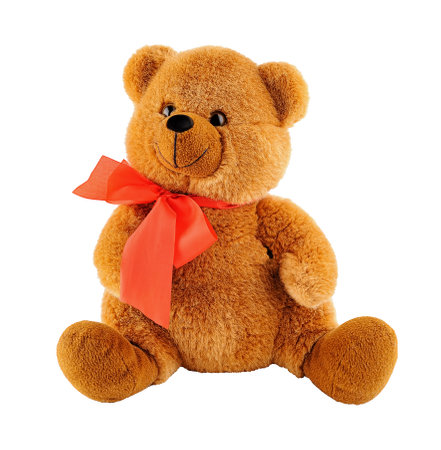 Soft sitting toy bear with a red bow isolatedの写真素材