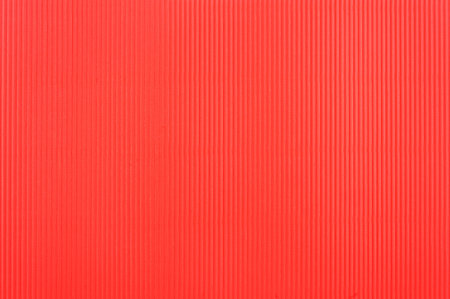 Red corrugated paper textured backgroundの写真素材