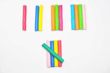  colorful plasticine stick counted on white backgroundの写真素材