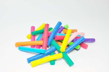 Bulk of colorful plasticine stick stand on white backgroundの写真素材