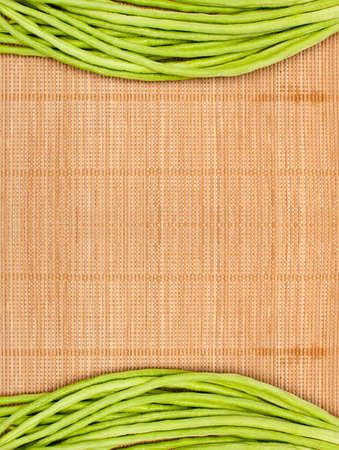 abstract design background vegetables on a wooden bamboo matbackground