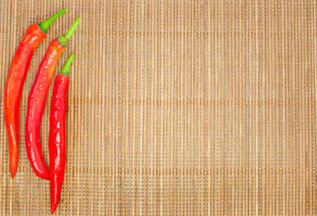 abstract design background vegetables on a bamboo mat backgroundの写真素材