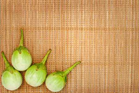 abstract design background vegetables on a bamboo mat backgroundの写真素材
