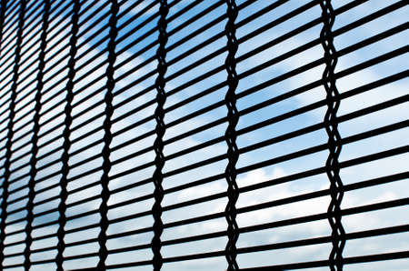 metallic net with sky backgroundの写真素材