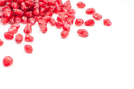  pomegranate seeds isolated on white selective focusの写真素材