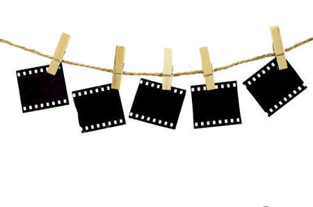 Blank photo frames with hanger on rope with white backgroundの写真素材