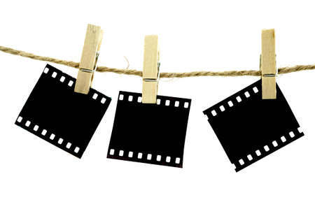Blank photo frames with hanger on rope with white backgroundの写真素材