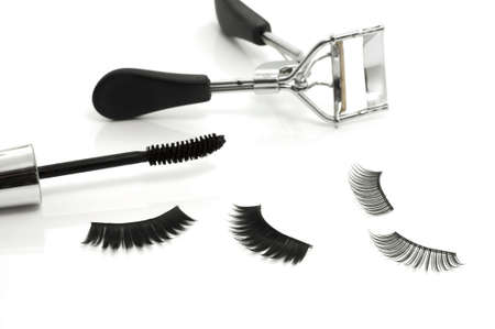 Macro of eyelash curler, mascara and false eyelashes isolated on whiteの写真素材