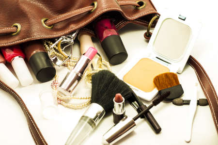 woman leather bag with cosmetics , tools and brushesの写真素材