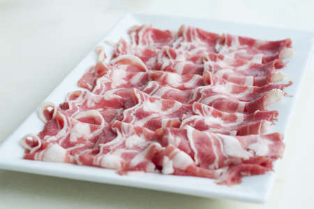 Sliced lamb meat on plate for shabuの写真素材