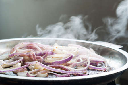 Red onion fried in  panの写真素材