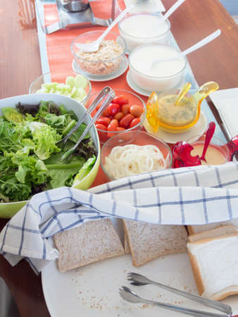 Healthy breakfast with bread, salad and yogurth の写真素材