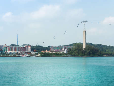 SINGAPORE - MARCH 08: Cable cars from Singapore to Sentosa Island and back as seen on MARCH 8, 2014. Sentosa has a theme park, sand beach, resort, yacht marina, hotel and luxury residence.のeditorial素材