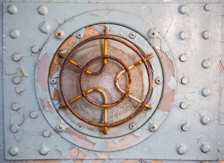 Old lamp on metal wall in military aircraft