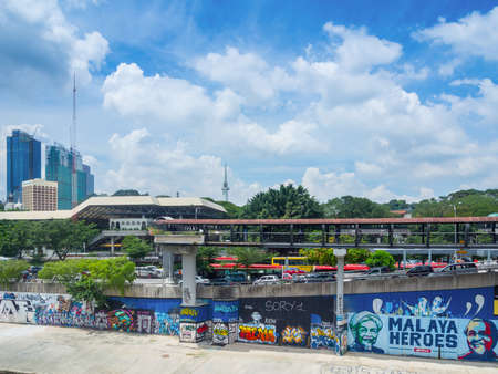 KUALA LUMPUR, MALAYSIA - NOVEMBER 14, 2014 : Urban graffiti along Klang River riverbank near the Pasar Seni LRT station in Kuala Lumpur, Malaysiaのeditorial素材