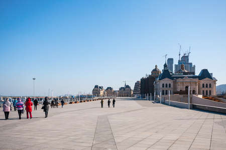 Dalian, China January 19, 2015: Tourist at attractive building on Dalian bay, China.のeditorial素材