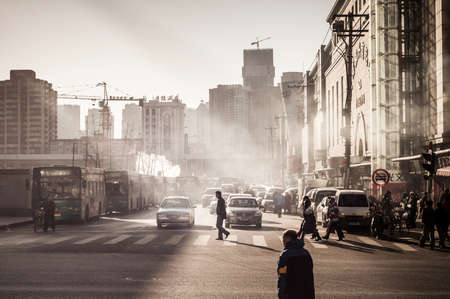 DALIAN, CHINA - JANUARY 19, 2015: People around commercial building around Dalian trains station.のeditorial素材