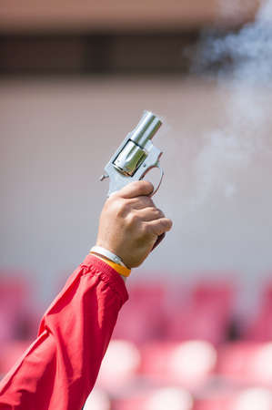 Image of fried pistol gun in red shirt man handの写真素材