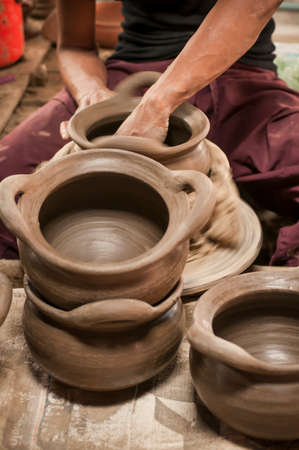 Artisan hands making clay potの写真素材