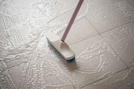 Floor cleaning with mob and cleanser foam.の写真素材