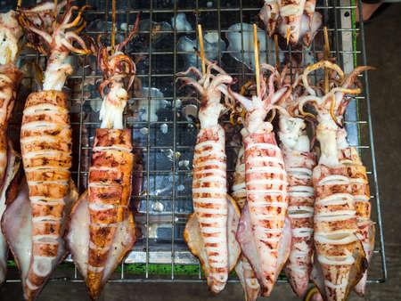 Grilled squids on stickの写真素材