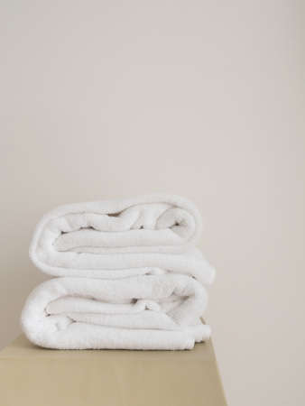 Towels fold on wooden tableの写真素材