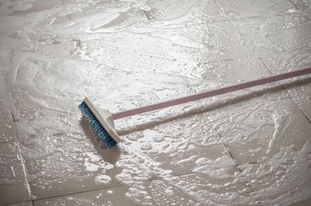 Floor cleaning with mob and cleanser foam.の写真素材