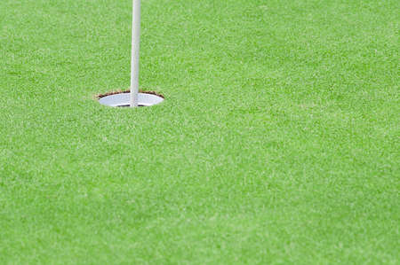 Putting green with flag poleの写真素材
