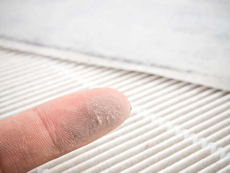 Dust on finger with air filtered on background.の写真素材