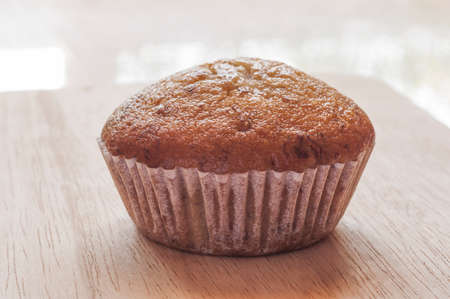 Banana cup cake on wood backgroundの写真素材