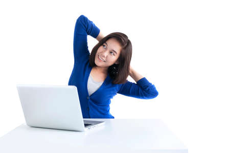Business woman do stretch with laptop in front isolated over white background.の写真素材