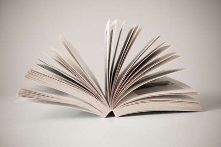 Old book open on white tableの写真素材