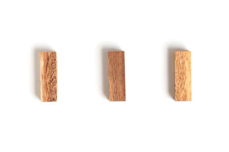 Three wood blocks arange in row on white background.の写真素材