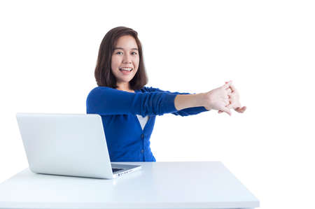 Business woman do stretch with laptop in front isolated over white background.