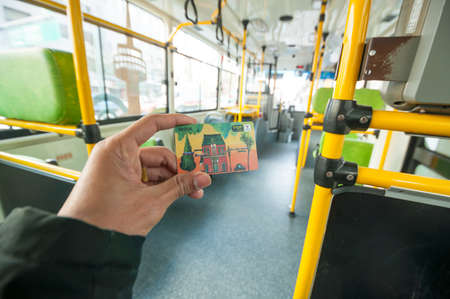 Seoul, South Korea - March 04, 2015 : Passenger showing T Money Card on Seoul public bus. The card can be use many public transport in South Korea.のeditorial素材
