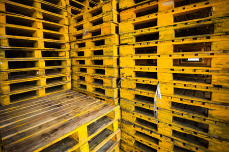 Old grunge yellow wood pallets background.の写真素材