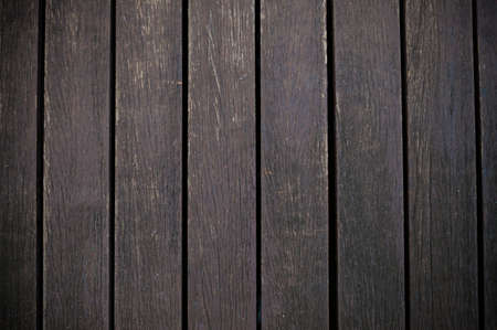 Dark brown wood plank background.の写真素材