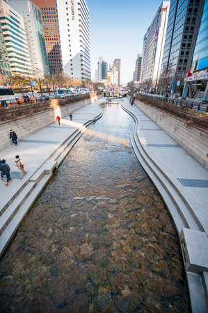 Seoul, South Korea - February 27, 2015: People at Cheonggyecheon stream. The stream is a 10.9Â km long, modern public recreation space in Seoul downtown.のeditorial素材