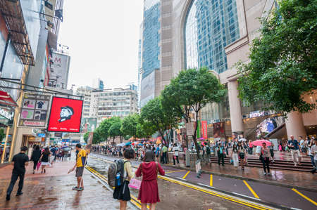 Hong Kong, China - October 03- 2015 : People waiting to cross through busy streets at Hong Kong Times Square in Causeway Bay . With 7M population, it is one of the most dense areas in the world.のeditorial素材