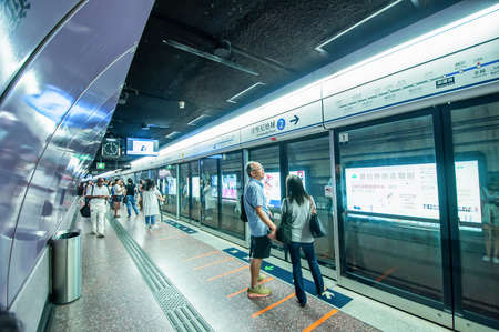 Hong Kong, China - October 03, 2015 : People waiting MTR train at Causeway Bay station.